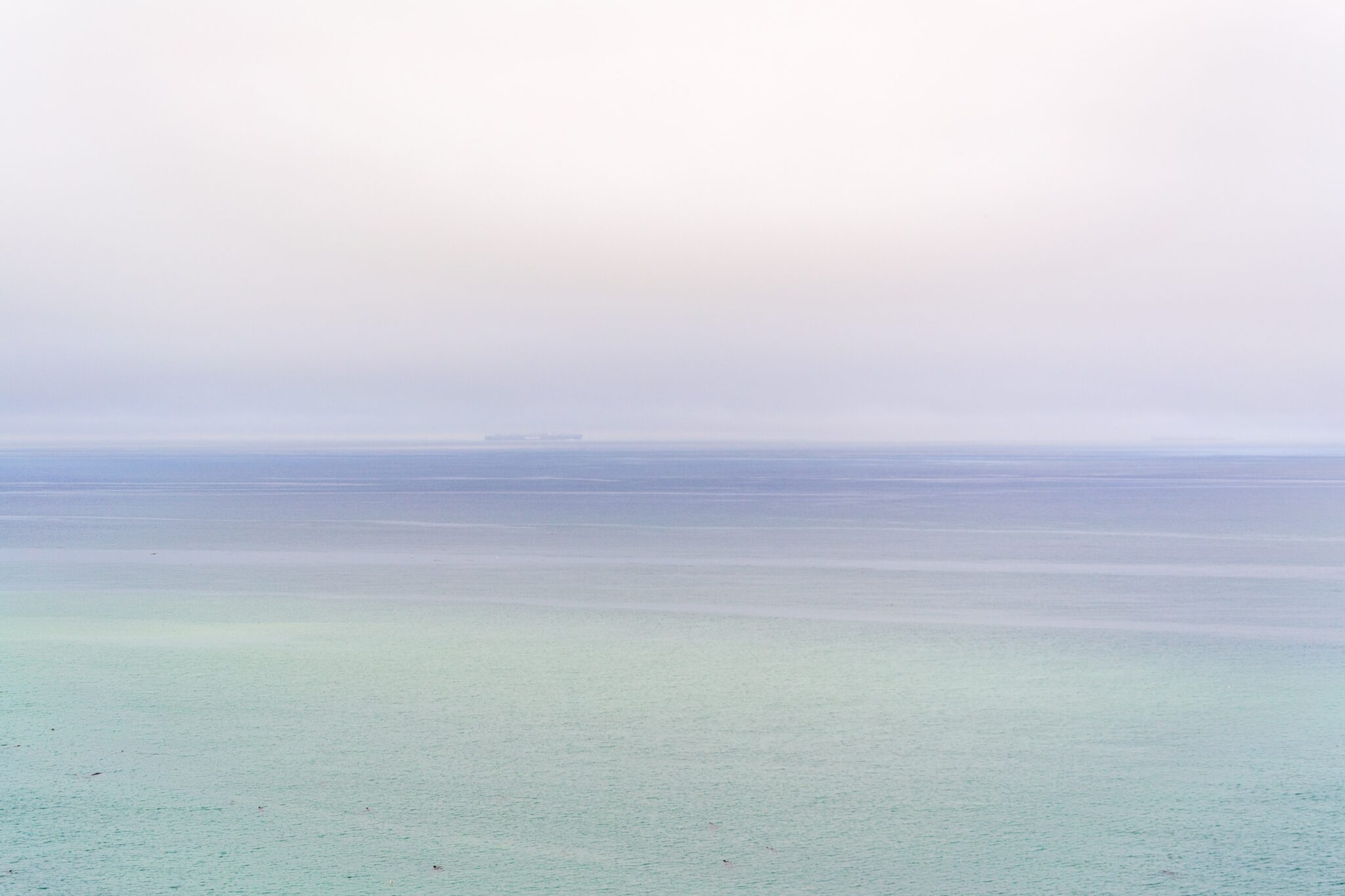 Beautiful blue ocean with waves crashing in to shore. If you are feeling the physical symptoms of anxiety an online therapist for anxiety in north carolina might be just the answer. Learn more here.