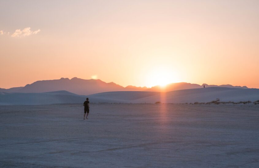 Man running in the desert at sunset. Suffering with trauma related anxiety can make you feel like you are constantly sprinting towards an unknown goal. Learn to slow down and take life in stride with anxiety treatment in Charlotte, NC.