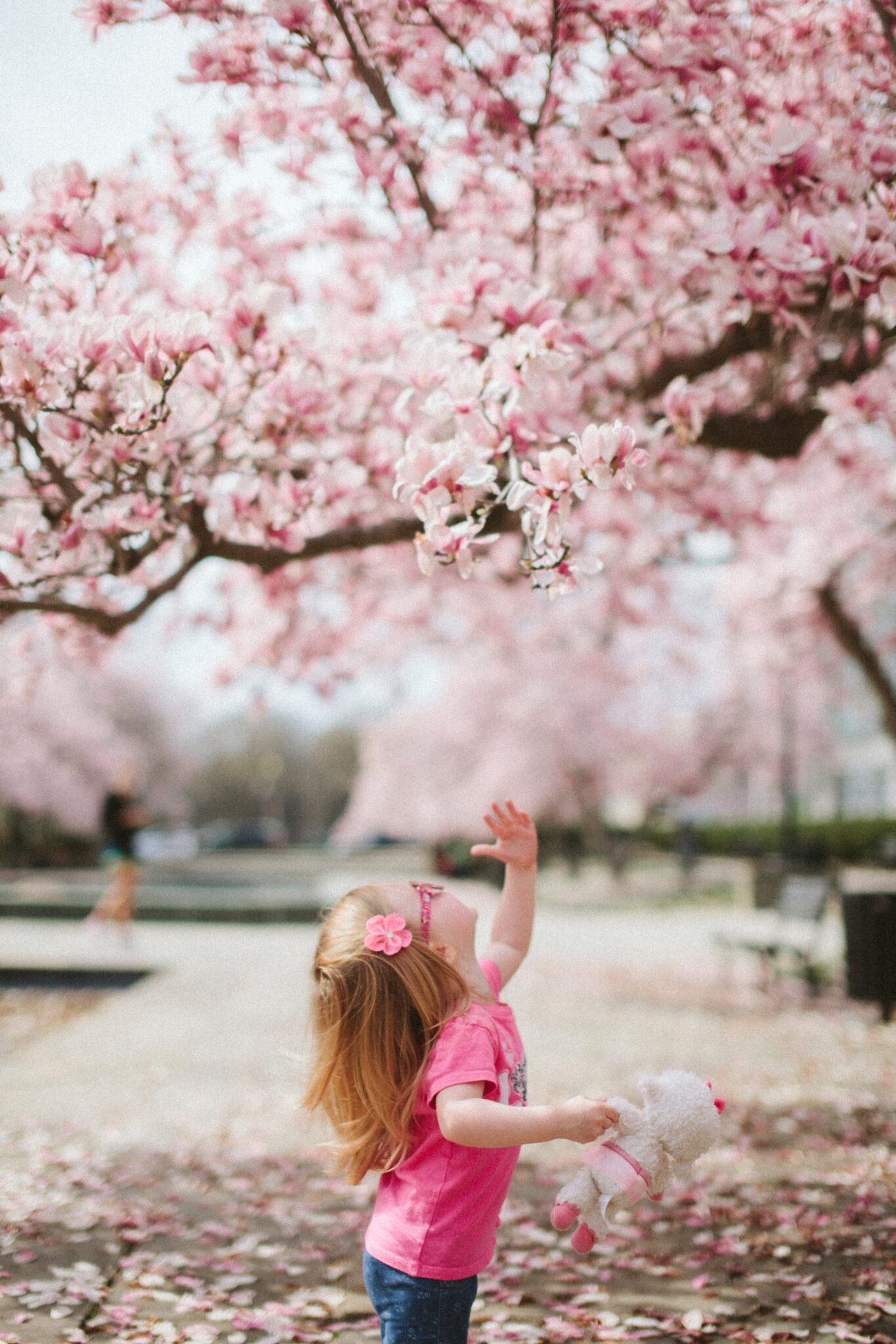girl under cherry blossom. childhood trauma, heal from childhood trauma, low-self-esteem
