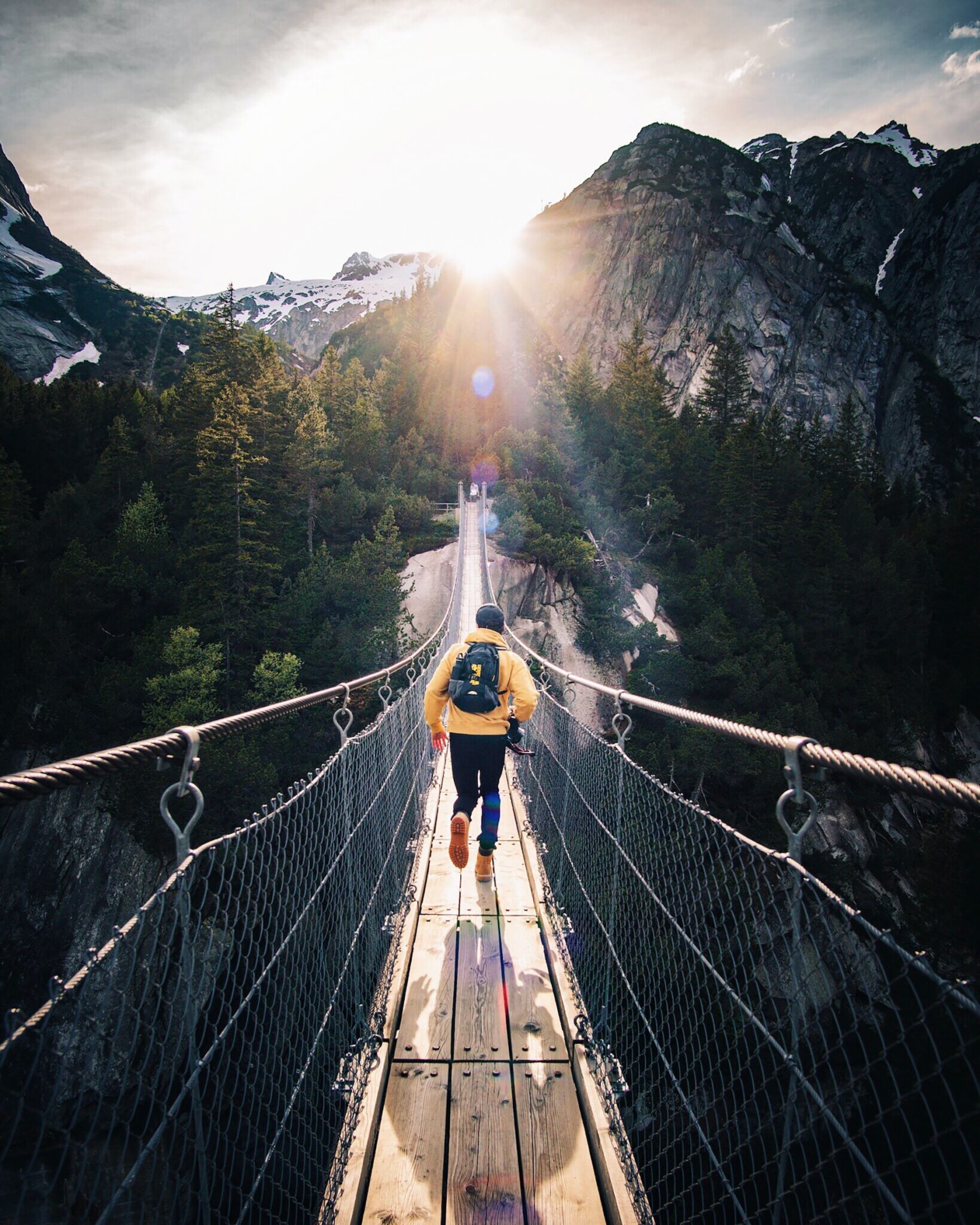 young adult walking on a bridge. life transitions, anxiety about adulting, young adult support, counseling for young adults