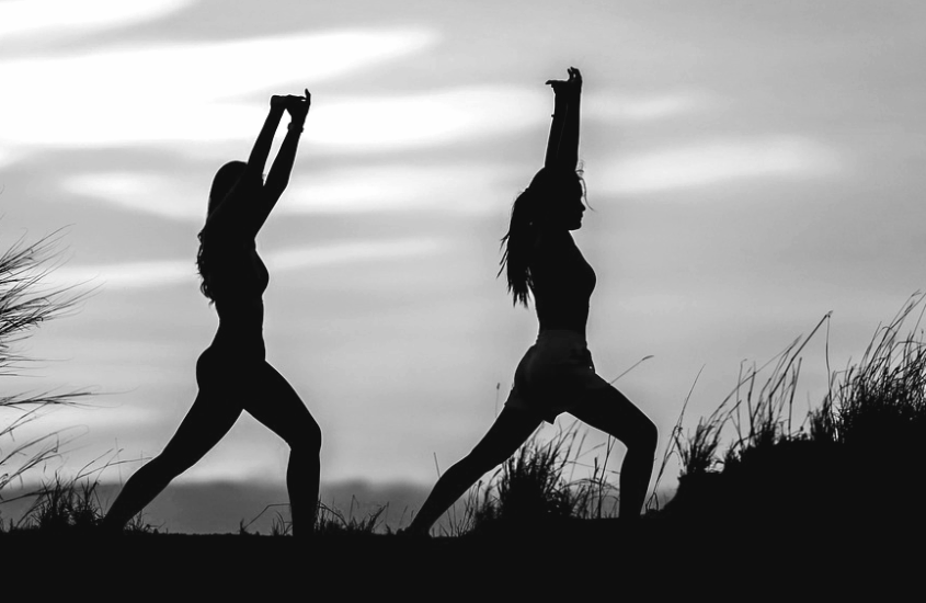 woman practicing yoga to release trauma